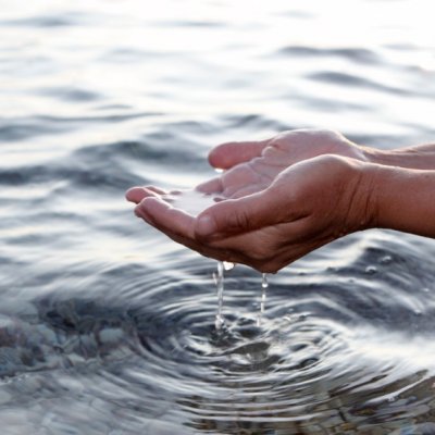 water running through hands